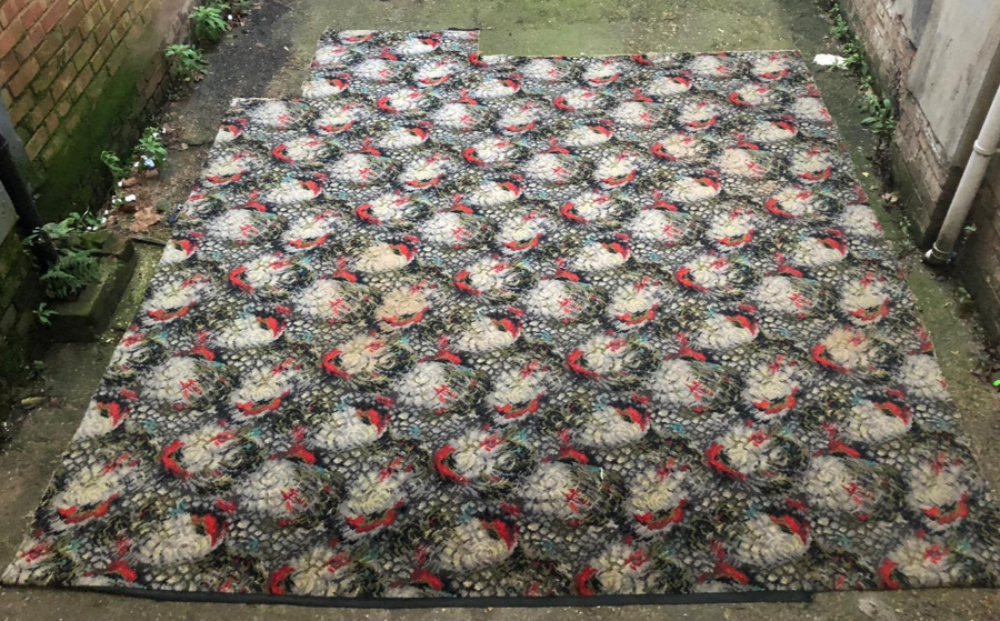 CARPET, GREY WITH RED B;LACK GREEN ABSTRACT DESIGN CUT CORNERS